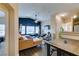 Bright living room with hardwood floors, comfortable seating, and an open-concept layout to the kitchen at 6576 Buster Brown Ave # 101, Las Vegas, NV 89122