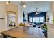 Inviting living room featuring large tan sectional sofa and a view to the main bedroom at 6576 Buster Brown Ave # 101, Las Vegas, NV 89122