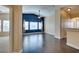 Bright living room boasts an accent wall, ceiling fan, and durable wood flooring for cozy living at 6576 Buster Brown Ave # 101, Las Vegas, NV 89122