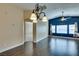 Cozy living room features wood floors, blue accent wall, and large windows at 6576 Buster Brown Ave # 101, Las Vegas, NV 89122
