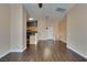 Spacious living room with durable wood flooring connects seamlessly to an open-concept kitchen, ideal for entertaining at 6576 Buster Brown Ave # 101, Las Vegas, NV 89122