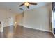 Spacious living area featuring durable wood flooring and ample lighting that enhances the room's bright atmosphere at 6576 Buster Brown Ave # 101, Las Vegas, NV 89122
