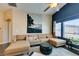 Comfortable living room with a large sectional sofa, stylish decor, and plenty of natural light at 6576 Buster Brown Ave # 101, Las Vegas, NV 89122