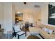 Inviting living room featuring access to the kitchen and dining area, great for entertaining at 6576 Buster Brown Ave # 101, Las Vegas, NV 89122