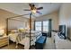 Main bedroom with canopy bed, neutral tones, and natural light at 6576 Buster Brown Ave # 101, Las Vegas, NV 89122