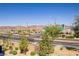 Balcony with an open view, street with desert landscaping and views of the mountains in the distance at 664 Foam Flower Ln, Henderson, NV 89015