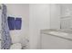 Clean bathroom with a granite countertop and blue-themed towels at 664 Foam Flower Ln, Henderson, NV 89015