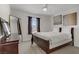Relaxing bedroom featuring a large mirror, lots of natural light, and a comfortable bed, creating a peaceful and inviting retreat at 664 Foam Flower Ln, Henderson, NV 89015