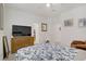 Spacious bedroom with walk-in closet, ensuite bathroom and view of the bed at 664 Foam Flower Ln, Henderson, NV 89015