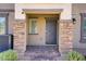 Inviting home entrance with stone accents and a well-maintained pathway at 664 Foam Flower Ln, Henderson, NV 89015
