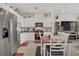 This bright kitchen features white cabinets, granite countertops, and stainless steel appliances at 664 Foam Flower Ln, Henderson, NV 89015
