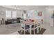 Spacious living room with large windows and cozy furniture at 664 Foam Flower Ln, Henderson, NV 89015