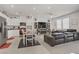Open floor plan featuring a modern kitchen, dining area, and comfortable living room at 664 Foam Flower Ln, Henderson, NV 89015