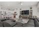 Open concept living room with kitchen featuring stainless steel appliances at 664 Foam Flower Ln, Henderson, NV 89015