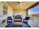 Enjoy the cozy covered patio with modern outdoor furniture and a view at 664 Foam Flower Ln, Henderson, NV 89015