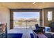 Relax on the covered patio, furnished with modern pieces and offering scenic views at 664 Foam Flower Ln, Henderson, NV 89015