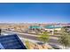 A scenic street view captures the neighborhood's charming landscape under a bright sky at 664 Foam Flower Ln, Henderson, NV 89015