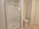 Shower and toilet room with a glass door shower and a tiled shower stall at 6853 Tamarus St # 202, Las Vegas, NV 89119