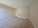 An empty bedroom featuring neutral paint, plush carpeting, and modern trim at 6853 Tamarus St # 202, Las Vegas, NV 89119