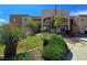 Attractive multi-story apartment building features well-maintained landscaping and desert-friendly plants at 6853 Tamarus St # 202, Las Vegas, NV 89119