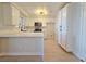Contemporary kitchen featuring white cabinetry, stainless appliances, and stylish countertops at 6853 Tamarus St # 202, Las Vegas, NV 89119
