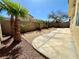 Backyard featuring a concrete patio and small rock garden at 7607 Pioneer Ranch Ave, Las Vegas, NV 89113
