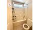 Bathroom showcasing a bathtub and shower with white tiling and a shower curtain at 7607 Pioneer Ranch Ave, Las Vegas, NV 89113