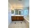 Bathroom boasts a double vanity with a full length mirror and soaking tub at 7607 Pioneer Ranch Ave, Las Vegas, NV 89113