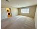 Spacious bedroom with neutral walls, carpeted floors, and ample natural light at 7607 Pioneer Ranch Ave, Las Vegas, NV 89113