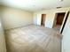 Spacious carpeted bedroom with neutral walls and closet at 7607 Pioneer Ranch Ave, Las Vegas, NV 89113