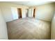 Large carpeted bedroom with closet at 7607 Pioneer Ranch Ave, Las Vegas, NV 89113