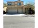 Two-story stucco home with a two-car garage and desert landscaping at 7607 Pioneer Ranch Ave, Las Vegas, NV 89113