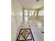 Inviting foyer with decorative tile flooring and views into adjacent living spaces at 7607 Pioneer Ranch Ave, Las Vegas, NV 89113
