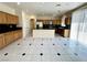 Expansive kitchen with granite countertops, stainless appliances, and large island at 7607 Pioneer Ranch Ave, Las Vegas, NV 89113