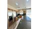 A kitchen with stainless steel appliances, wooden cabinets, and a granite countertop island at 7607 Pioneer Ranch Ave, Las Vegas, NV 89113