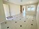 Spacious open-concept room featuring tile flooring and natural light at 7607 Pioneer Ranch Ave, Las Vegas, NV 89113