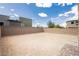 Large vacant backyard space with brick fence at 7777 Vino Vranec Ct, Las Vegas, NV 89113