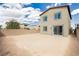 View of backyard with covered patio and sliding glass door entry at 7777 Vino Vranec Ct, Las Vegas, NV 89113