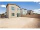 View of backyard with patio, play structure and brick fence at 7777 Vino Vranec Ct, Las Vegas, NV 89113