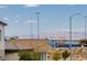 Mountains and city view above the backyard brick fence in this Las Vegas property at 7777 Vino Vranec Ct, Las Vegas, NV 89113