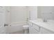 Bright bathroom featuring a shower-tub combo, tiled floors, and a modern vanity at 7777 Vino Vranec Ct, Las Vegas, NV 89113
