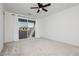 Bright bedroom with sliding glass doors and access to an outdoor balcony at 7777 Vino Vranec Ct, Las Vegas, NV 89113