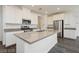 Bright kitchen featuring a kitchen island, stainless appliances, recessed lighting, and light gray countertops at 7777 Vino Vranec Ct, Las Vegas, NV 89113