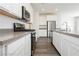 Modern kitchen featuring white cabinets, stainless appliances, recessed lights and gray countertops at 7777 Vino Vranec Ct, Las Vegas, NV 89113