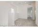 The neutrally-carpeted loft provides access to other rooms and plenty of space at 7777 Vino Vranec Ct, Las Vegas, NV 89113