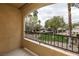 Balcony overlooking lush greenery, a pool area, mature trees, and serene landscaping at 7885 W Flamingo Rd # 2005, Las Vegas, NV 89147