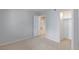 Neutral bedroom with carpet floors, open closet and view of living area at 7885 W Flamingo Rd # 2005, Las Vegas, NV 89147