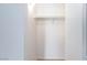 Walk-in closet features a white interior and a shelf and rail system at 7885 W Flamingo Rd # 2005, Las Vegas, NV 89147