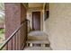 Apartment entryway featuring a covered porch, the unit number, and secure, dark-brown door at 7885 W Flamingo Rd # 2005, Las Vegas, NV 89147