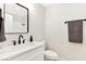 This bright bathroom features a marble countertop, black faucet, and a sleek, modern design at 811 Spyglass Ln, Las Vegas, NV 89107